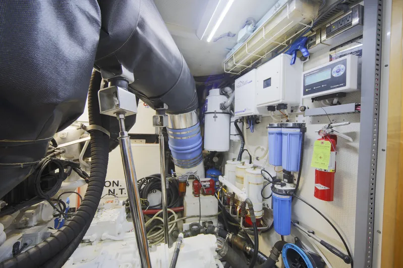 Southern Lady Yacht Photos Pics Engine room of a 2006 Horizon E73 yacht with complex machinery and equipment.
