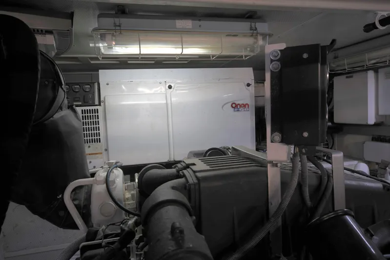 Southern Lady Yacht Photos Pics Engine room of a 2006 Horizon E73 yacht with Onan generator and equipment.