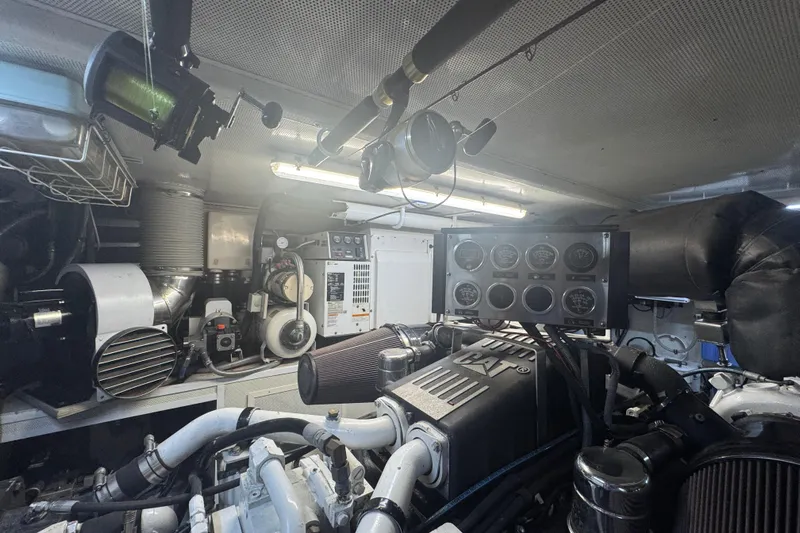 Southern Lady Yacht Photos Pics Engine room of a 2006 Horizon E73 yacht with gauges and machinery.