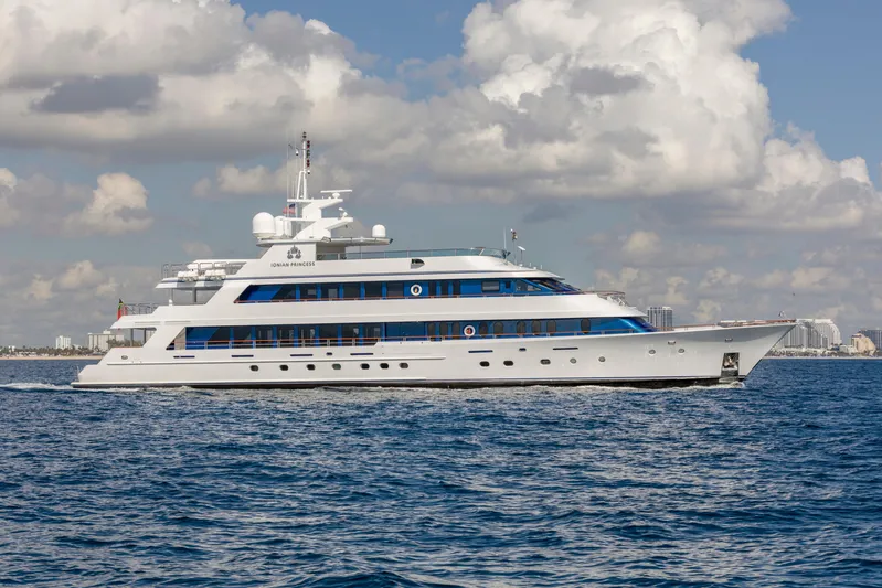 Ionian Princess Yacht Photos Pics Christensen 2005 Tri-Deck Motor Yacht cruising on open water under cloudy skies.