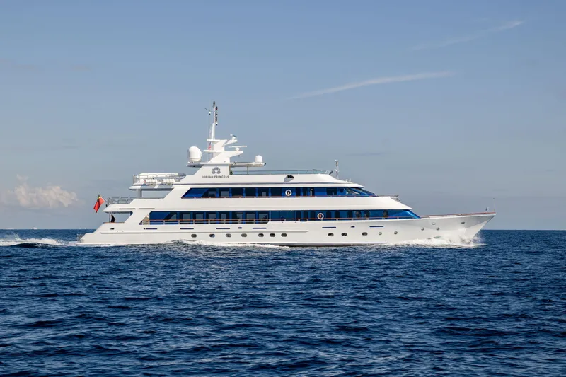 Ionian Princess Yacht Photos Pics Luxurious 2005 Christensen Tri-Deck Motor Yacht cruising on open sea.