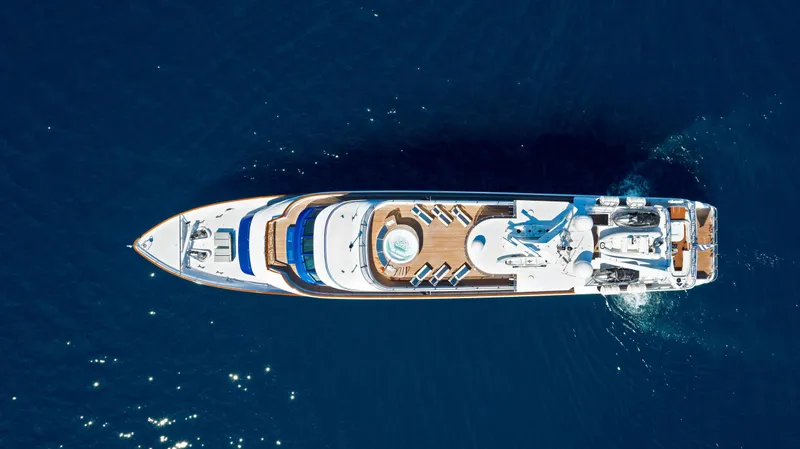 Ionian Princess Yacht Photos Pics Aerial view of 2005 Christensen Tri-Deck Motor Yacht cruising on deep blue ocean.