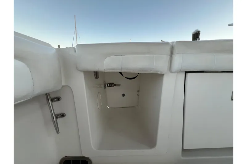  Yacht Photos Pics 2018 Regulator 28 boat storage compartment with white interior and seating.