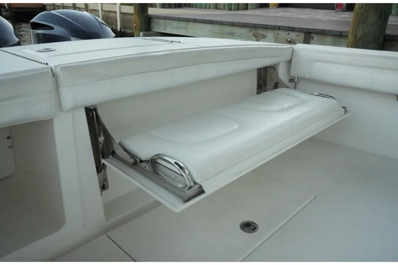  Yacht Photos Pics Fold-down seat on a 2018 Regulator 28 boat, showcasing sleek design and functionality.