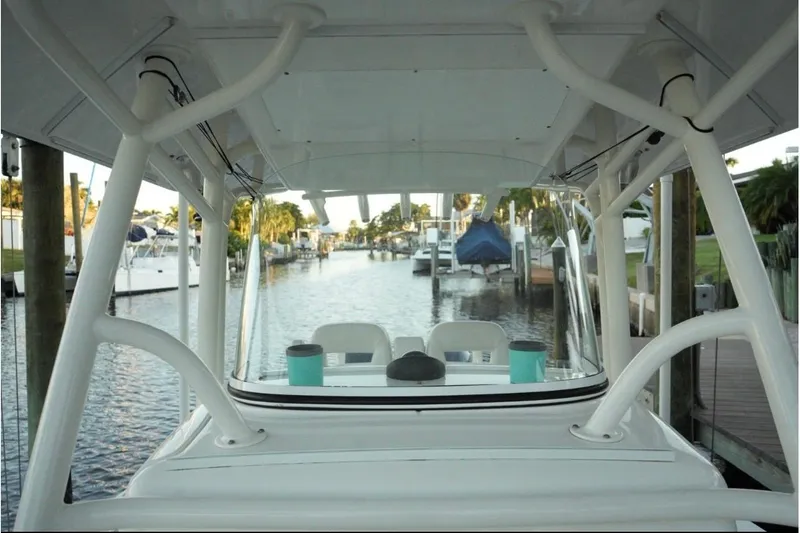  Yacht Photos Pics 2018 Regulator 28 boat docked in a marina, view from the helm.