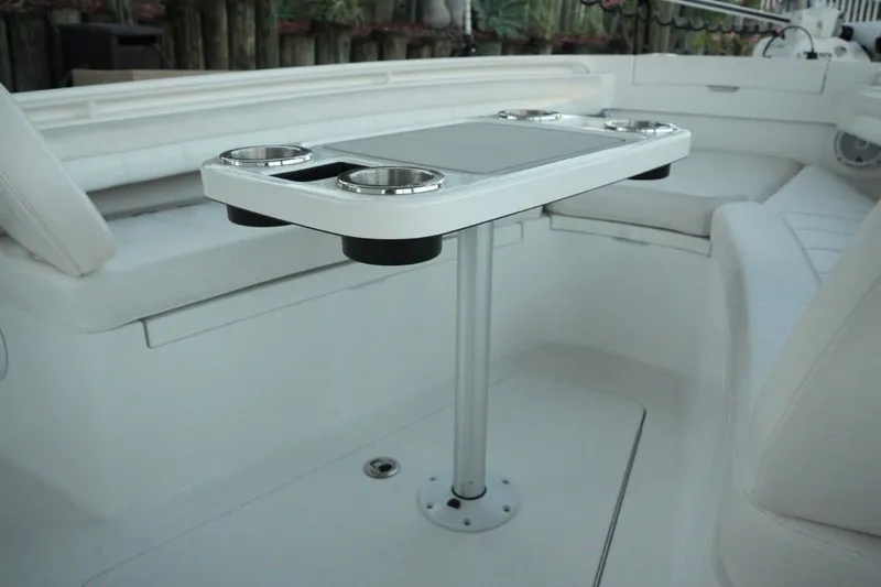  Yacht Photos Pics 2018 Regulator 28 boat interior with table and cup holders.