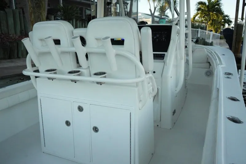  Yacht Photos Pics 2018 Regulator 28 boat interior with rod holders and seating.