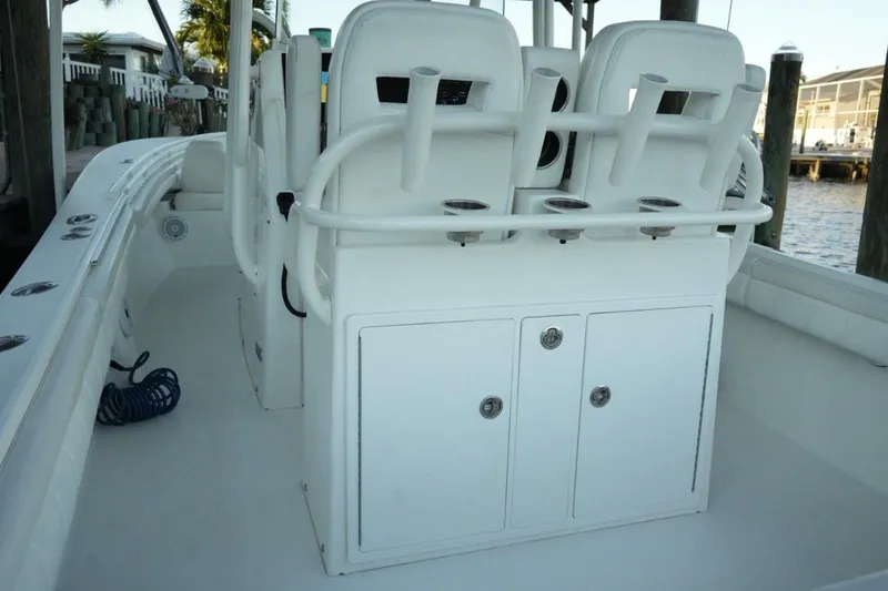  Yacht Photos Pics 2018 Regulator 28 boat interior with seating and storage compartments.