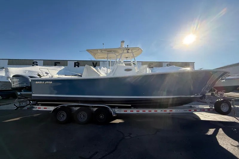  Yacht Photos Pics 2010 Regulator 34SS boat on trailer under bright sun.