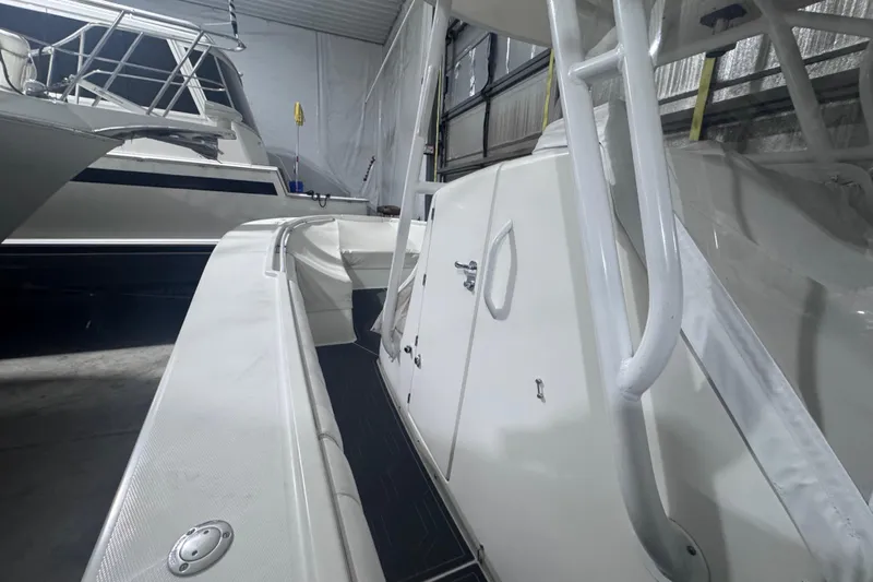  Yacht Photos Pics 2010 Regulator 34SS boat in storage, showcasing sleek white design and spacious deck.