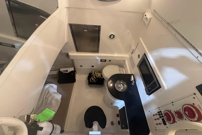  Yacht Photos Pics 2010 Regulator 34SS boat interior with sink, toilet, and control panel.
