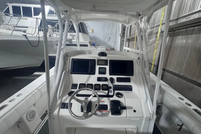  Yacht Photos Pics 2010 Regulator 34SS boat cockpit with advanced navigation controls and steering wheel.