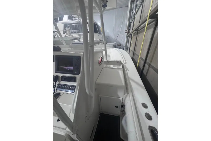  Yacht Photos Pics 2010 Regulator 34SS boat interior with control panel and seating area.