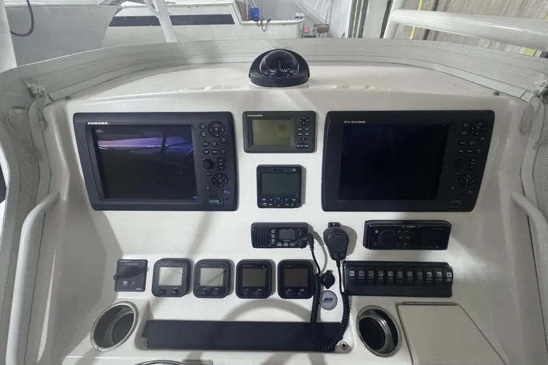  Yacht Photos Pics Control panel of a 2010 Regulator 34SS boat with navigation and communication equipment.
