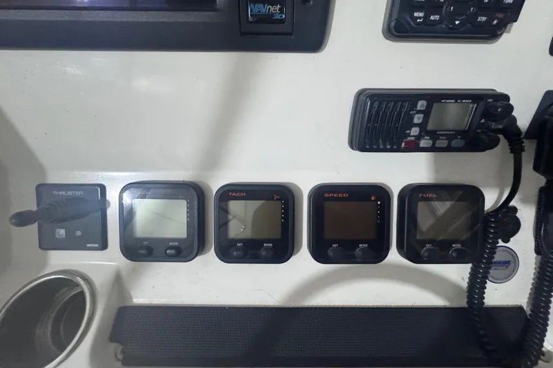  Yacht Photos Pics Control panel of a 2010 Regulator 34SS boat with various gauges and radio.