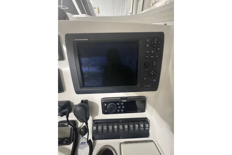  Yacht Photos Pics Control panel of a 2010 Regulator 34SS boat featuring navigation and communication equipment.