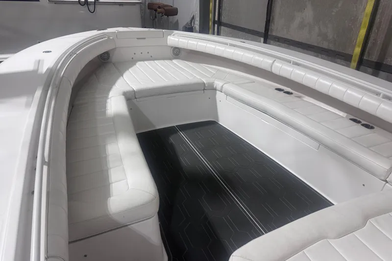  Yacht Photos Pics 2010 Regulator 34SS boat interior with white cushioned seating and sleek design.