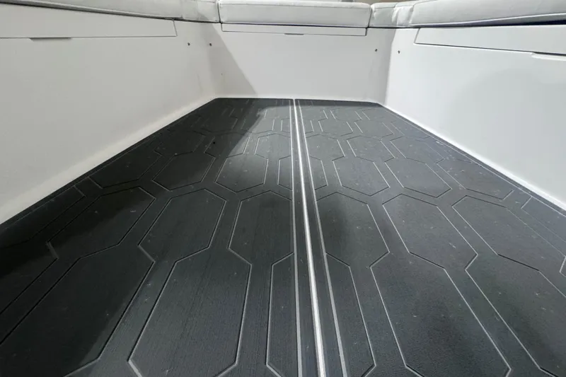  Yacht Photos Pics 2010 Regulator 34SS boat interior with textured flooring and cushioned seating.