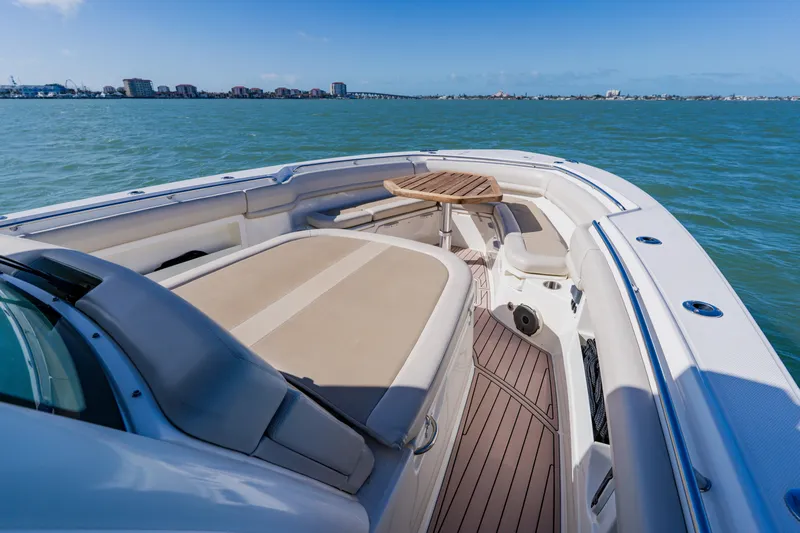 Spec-tacular Li Li Yacht Photos Pics 2019 Boston Whaler 380 Outrage boat interior with seating and table on open water.