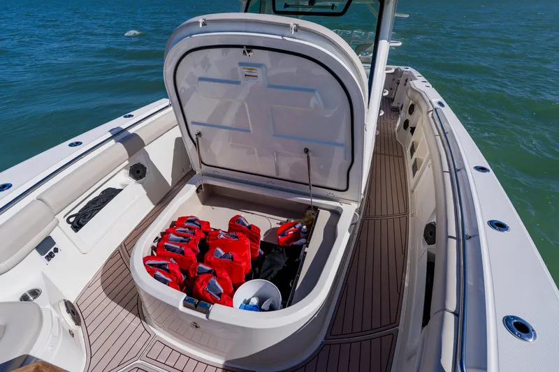 Spec-tacular Li Li Yacht Photos Pics 2019 Boston Whaler 380 Outrage boat with open storage compartment and life jackets.