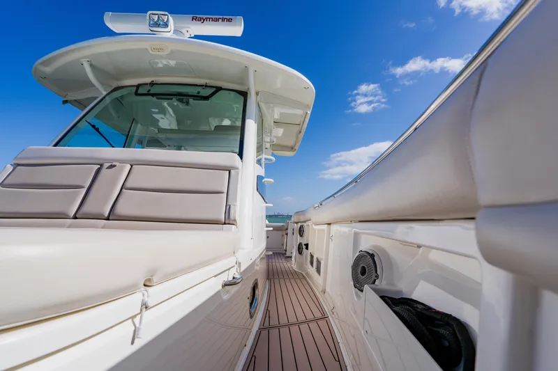 Spec-tacular Li Li Yacht Photos Pics 2019 Boston Whaler 380 Outrage boat deck with clear blue sky background.