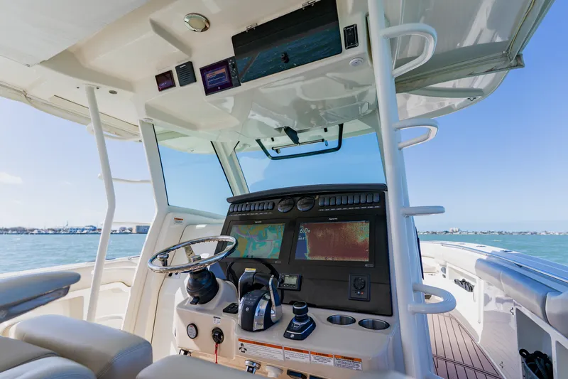 Spec-tacular Li Li Yacht Photos Pics 2019 Boston Whaler 380 Outrage helm with advanced navigation system on open water.