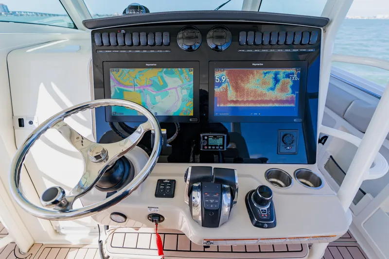 Spec-tacular Li Li Yacht Photos Pics 2019 Boston Whaler 380 Outrage helm with advanced navigation displays and controls.