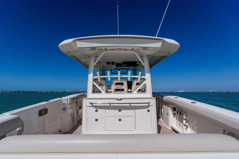 Spec-tacular Li Li Yacht Photos Pics 2019 Boston Whaler 380 Outrage boat on open water, clear blue sky.