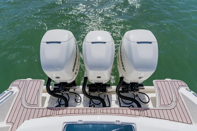 Spec-tacular Li Li Yacht Photos Pics 2019 Boston Whaler 380 Outrage with triple Mercury outboard engines on water.