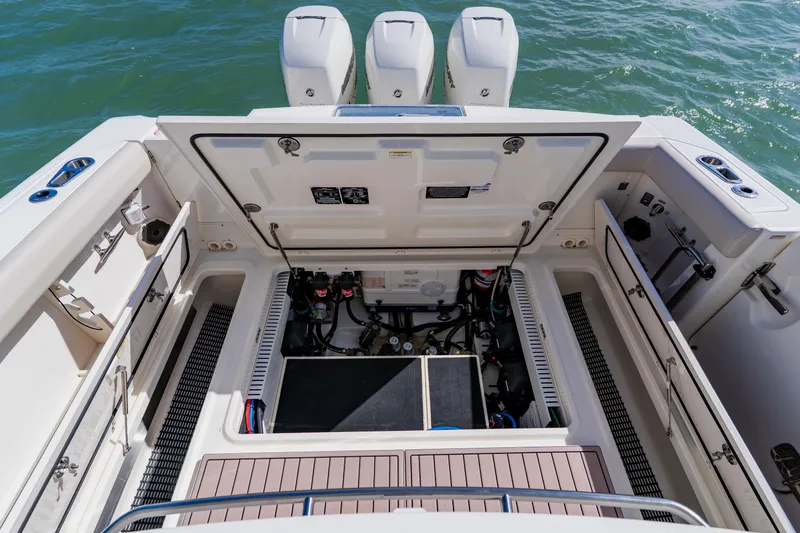 Spec-tacular Li Li Yacht Photos Pics 2019 Boston Whaler 380 Outrage engine compartment with open hatch, showcasing mechanical components.