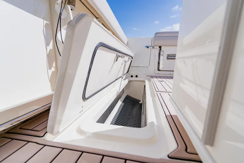 Spec-tacular Li Li Yacht Photos Pics 2019 Boston Whaler 380 Outrage storage compartment with open hatch on deck.