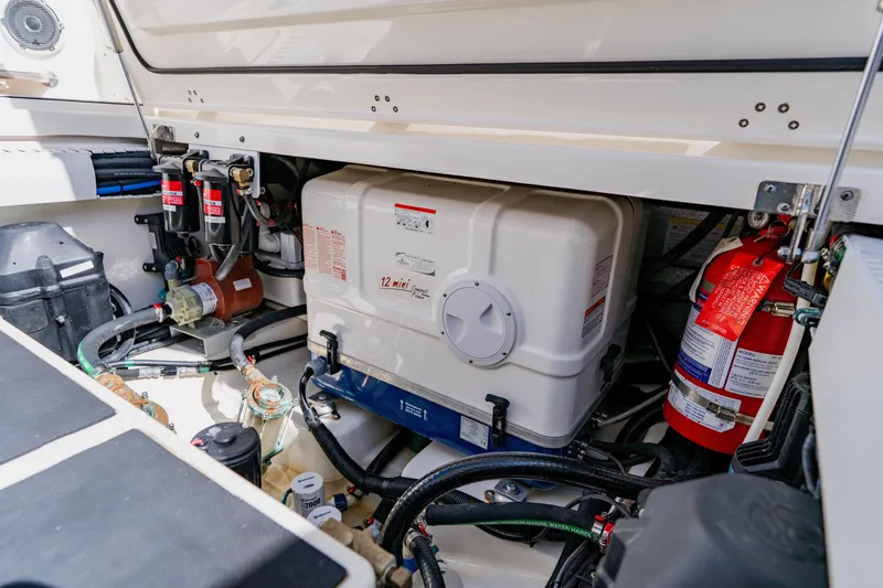 Spec-tacular Li Li Yacht Photos Pics Engine compartment of a 2019 Boston Whaler 380 Outrage, featuring equipment and safety gear.