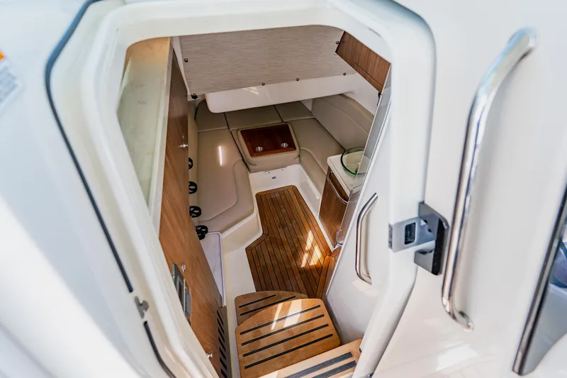 Spec-tacular Li Li Yacht Photos Pics 2019 Boston Whaler 380 Outrage cabin interior with wood flooring and seating area.