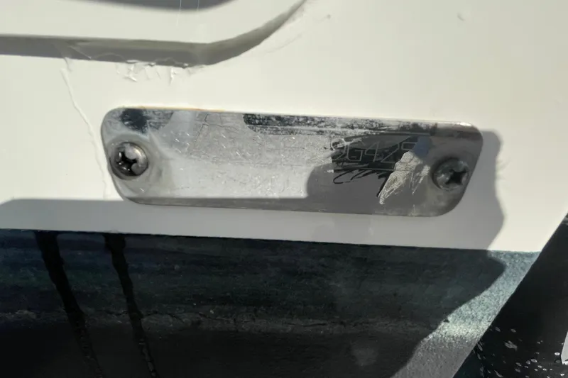  Yacht Photos Pics 2025 Boston Whaler 280 Outrage nameplate with visible wear and screws.