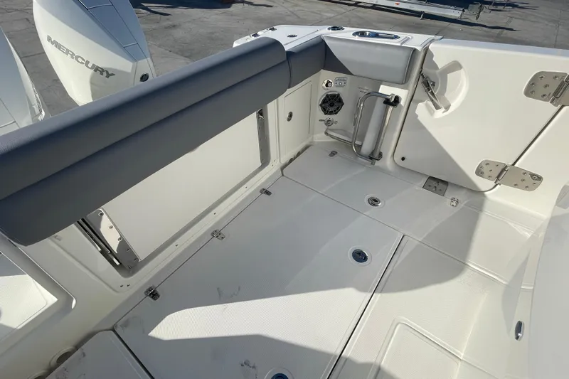  Yacht Photos Pics 2025 Boston Whaler 280 Outrage boat deck with Mercury engine, featuring sleek design and modern fittings.