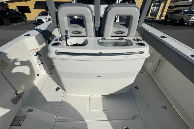  Yacht Photos Pics 2025 Boston Whaler 280 Outrage boat interior with seating and storage features.