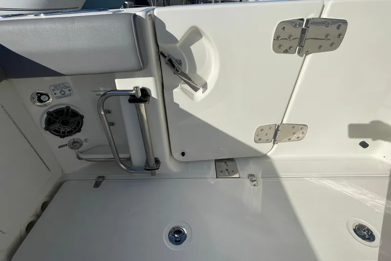  Yacht Photos Pics 2025 Boston Whaler 280 Outrage boat interior with stainless steel fixtures and speaker.