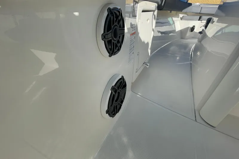  Yacht Photos Pics 2025 Boston Whaler 280 Outrage interior with dual speakers and sleek design.