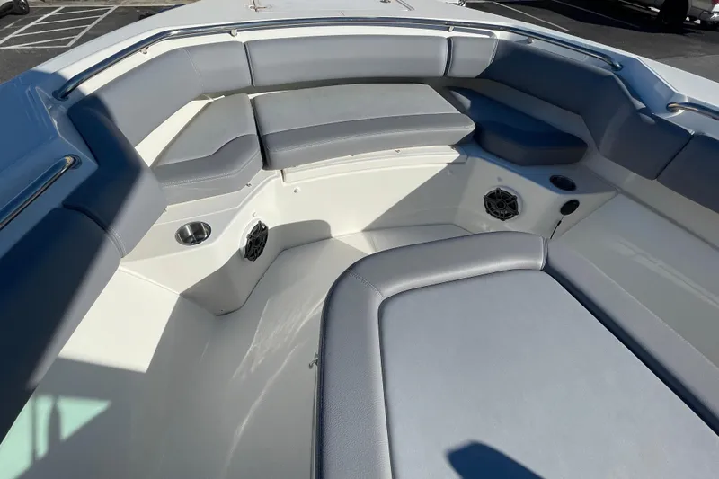  Yacht Photos Pics 2025 Boston Whaler 280 Outrage boat interior with cushioned seating and cup holders.
