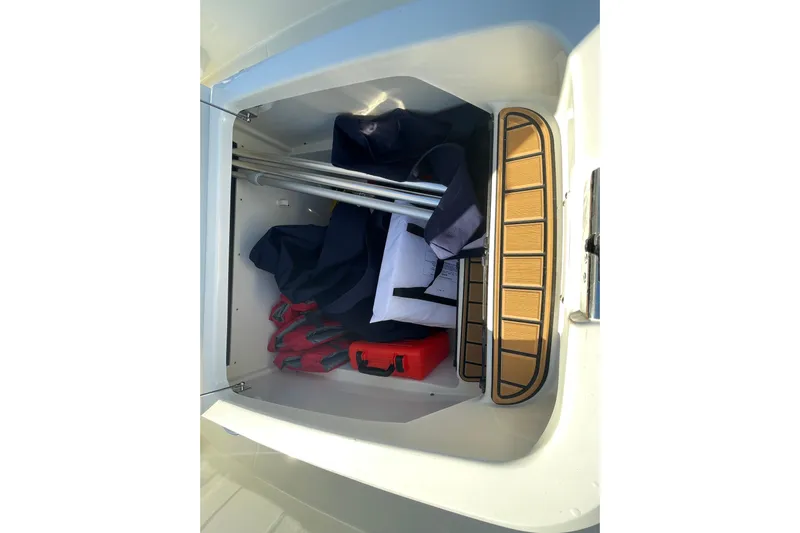  Yacht Photos Pics Storage compartment of 2025 Boston Whaler 280 Outrage with life jackets and equipment.
