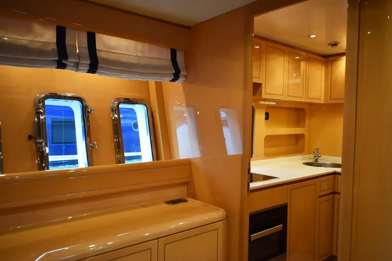 Querencia Yacht Photos Pics Interior of 2004 Mangusta 72 Hardtop yacht with kitchen and windows.