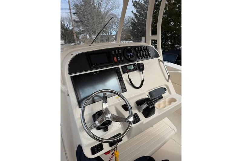  Yacht Photos Pics 2019 Grady-White Canyon 306 boat dashboard with steering wheel and navigation controls.