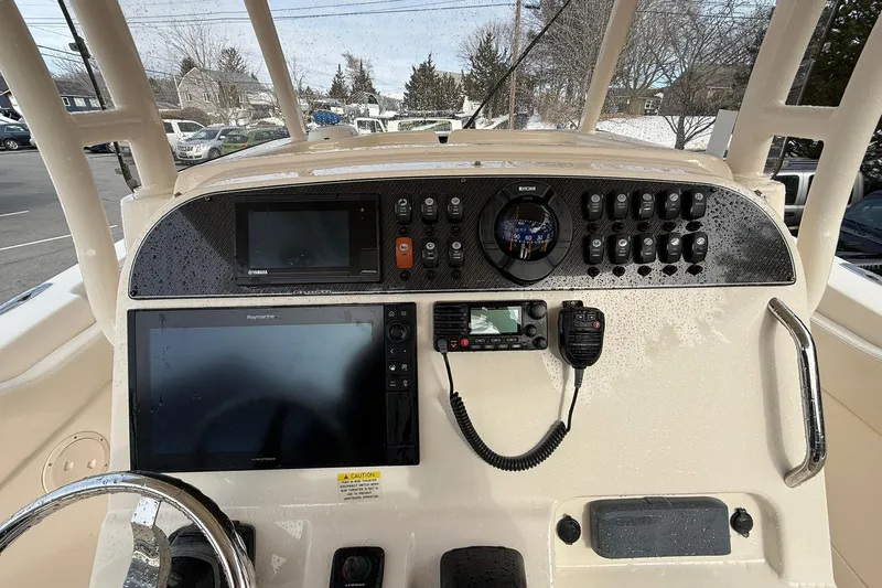  Yacht Photos Pics 2019 Grady-White Canyon 306 boat dashboard with navigation and communication equipment.
