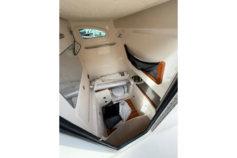  Yacht Photos Pics 2019 Grady-White Canyon 306 cabin interior with storage and seating.