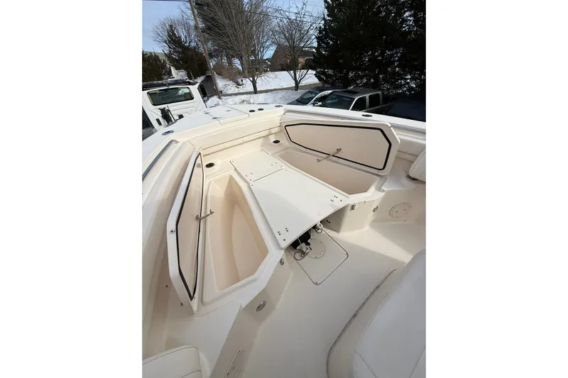  Yacht Photos Pics 2019 Grady-White Canyon 306 boat interior with open storage compartments.