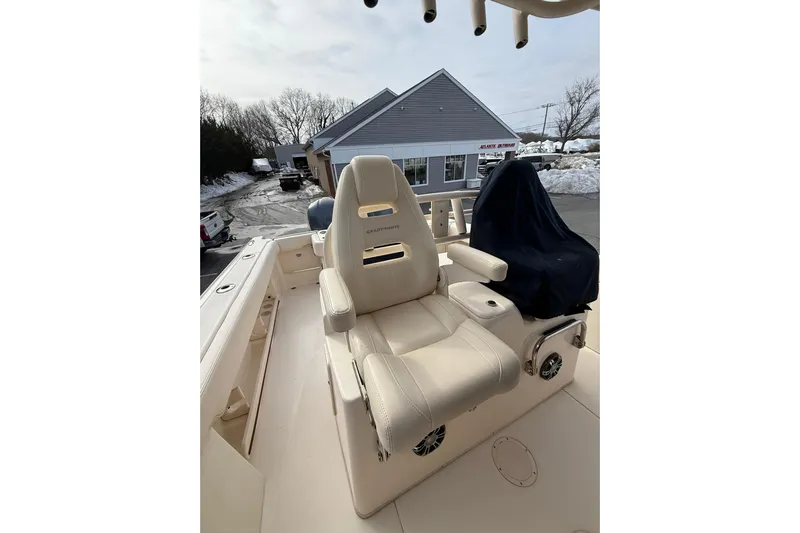  Yacht Photos Pics 2019 Grady-White Canyon 306 boat interior with beige seating and covered console.