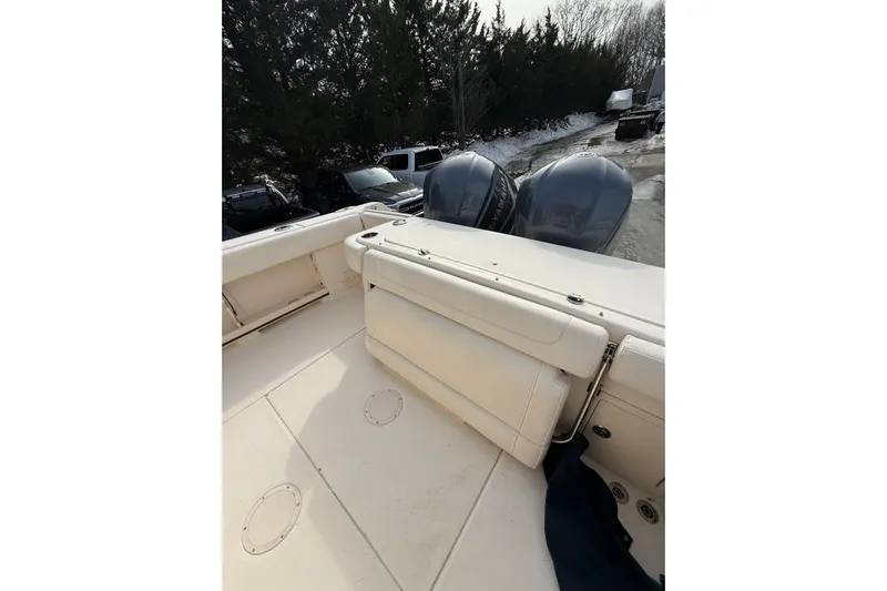  Yacht Photos Pics 2019 Grady-White Canyon 306 boat with dual outboard engines, parked outdoors.