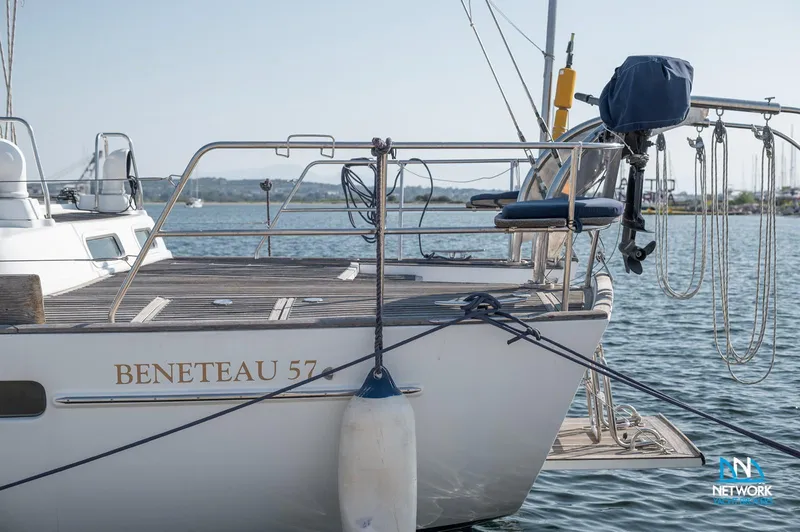  Yacht Photos Pics Sailboat Beneteau 57, 2004 model, docked with visible deck and railing.