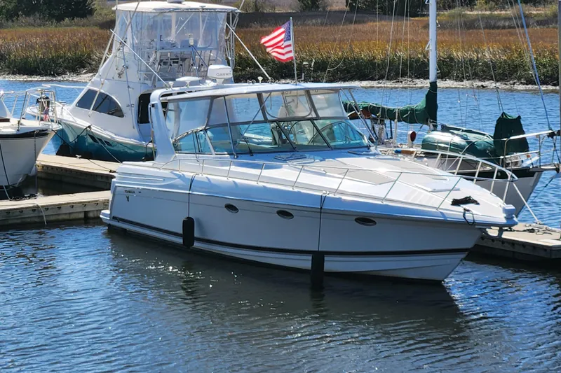 H Yacht Photos Pics 2000 Formula 41 Performance Cruiser docked in a marina with American flag.