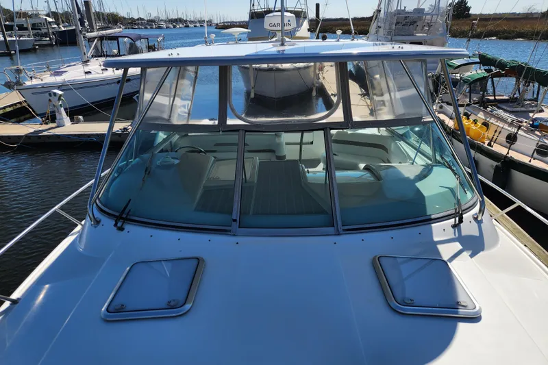 H Yacht Photos Pics 2000 Formula 41 Performance Cruiser docked at marina, showcasing sleek design and spacious deck.